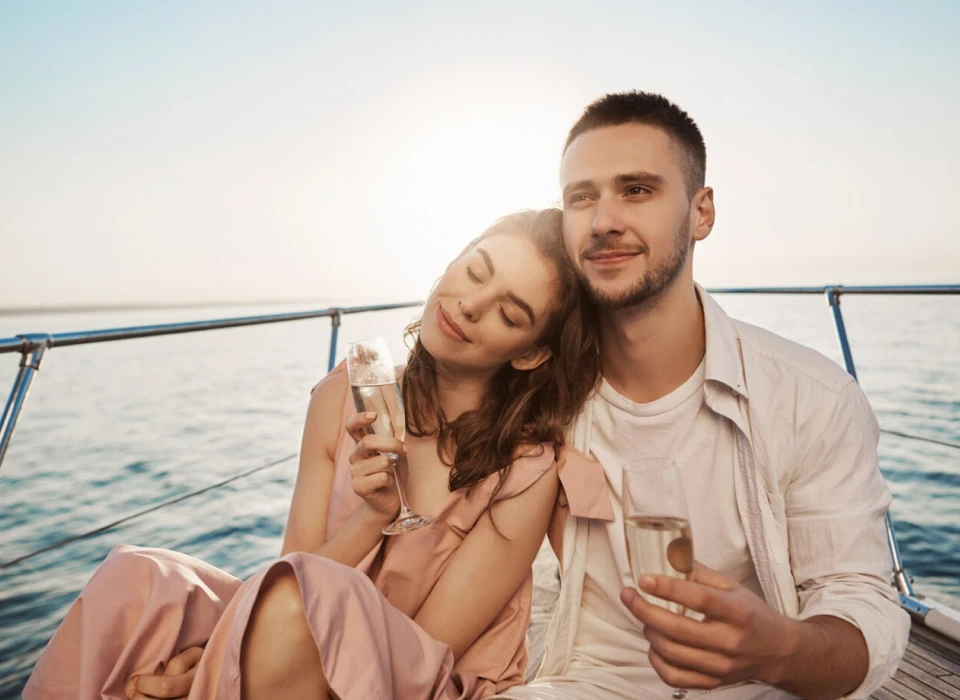 Couple enjoying a luxury yacht journey.