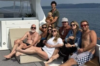 Group of friends relaxing on San Juan Alaska yacht charter deck